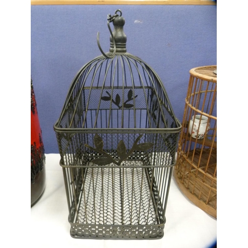 49 - Two bird cages.