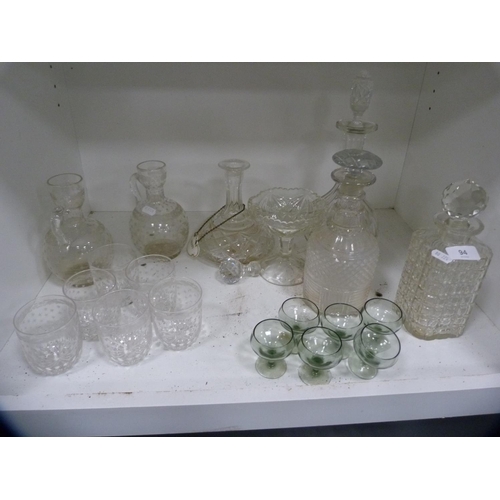 94 - Collection of glass decanters, set of six tumblers, two claret jugs etc (one shelf).