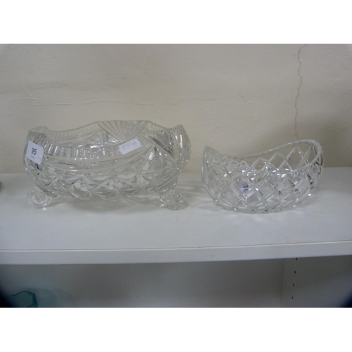 95 - Heavy cut glass fruit bowl on three scroll supports and a boat-shaped bowl.  (2)