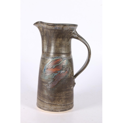 62 - Studio Pottery jug with irregular organic coloured glaze, indistinctly marked, 21cm.