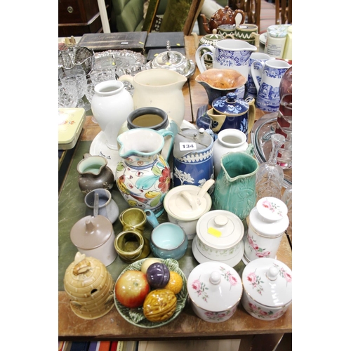 134 - Ceramics to include vintage jugs, pots, a honey pot, etc.