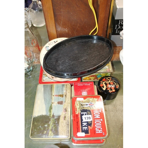 139 - Vintage tins and cases, and an ebony dressing table tray.