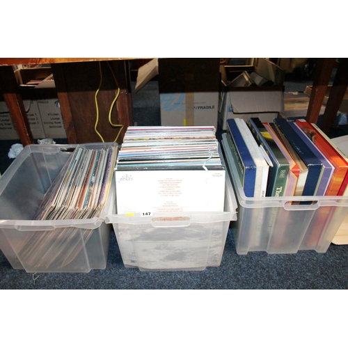 147 - Three boxes containing records.