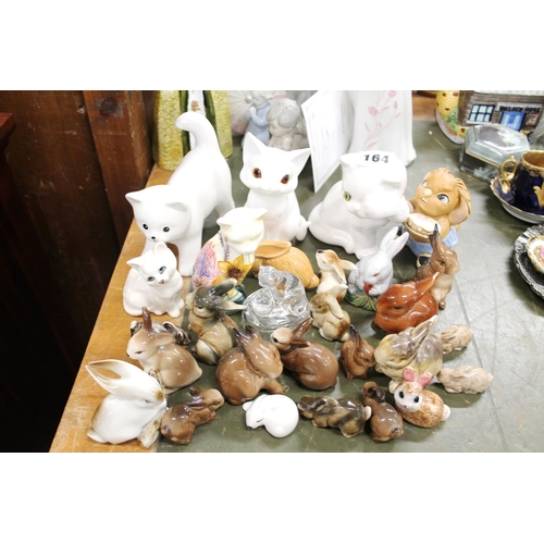 164 - Ceramic cat and rabbit models to include Beswick, Old Tuptonware, Pendelfin, etc.