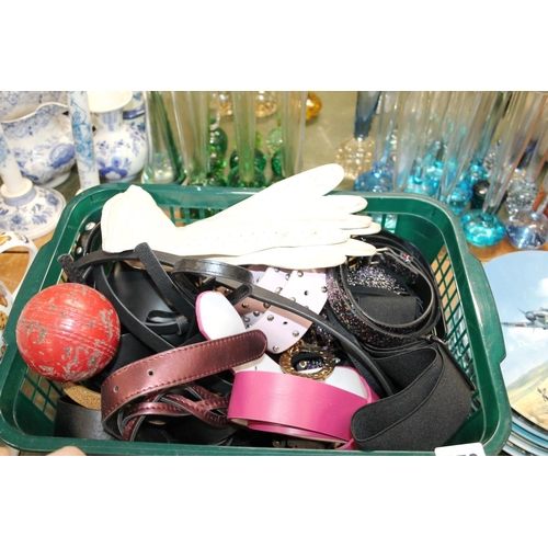 170 - Basket containing belts, buckles, a pair of lady's leather gloves, and a cricket ball.