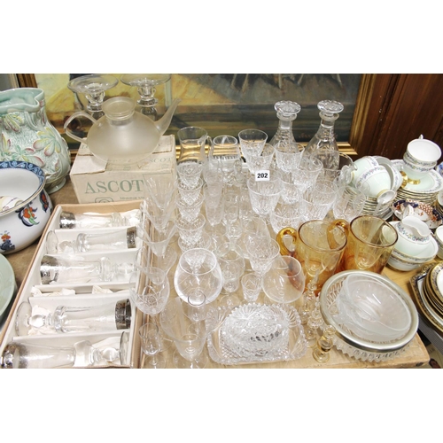 202 - Glassware to include decanters, a teapot, drinking glasses, etc.