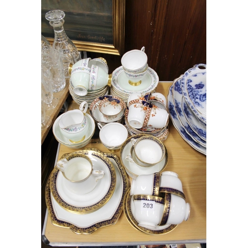 203 - Diamond china blue and gilt decorated teaset, a Tuscan china teaset, and another.