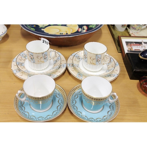 210 - Two Victorian trios and a pair of Minton style blue ground cups and saucers.