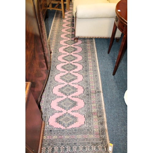 562 - Pink ground geometric hall runner, 350cm long.