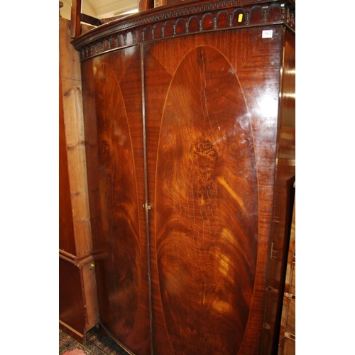 563 - Mahogany and inlaid two door wardrobe.