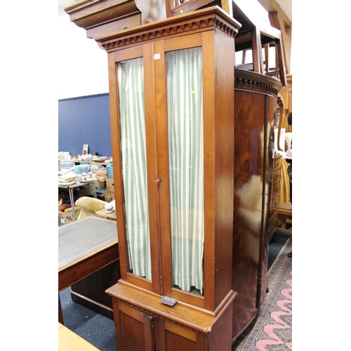 565 - Pine two door cabinet, with two glazed doors, 224cm high.