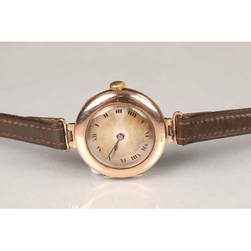 128a - Early ladies 9 carat gold Rolex wristwatch, plain dial with black hands and Roman numerals, 15 jewel... 