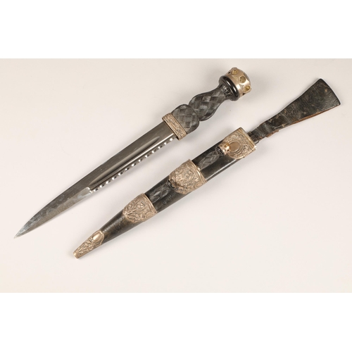 177 - Scottish dirk and scabbard, with an embossed silver thistle mounts, assay marked Edinburgh 1918, unm... 