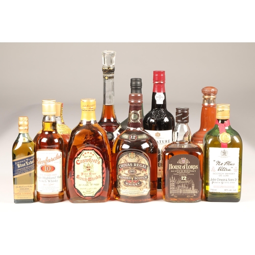 223 - Eight assorted bottles of whisky, two bottles of port and a cognac including: Bells blended scotch w... 