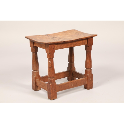 452 - Robert Mouseman of Kilburn oak stool, the adzed saddle seat on octagonal chamfered legs united by pl... 
