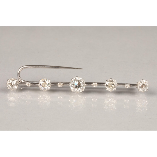 61 - Five stone diamond bar brooch ,unmarked white metal 0.75 carat brilliant cut centre diamond, with tw... 