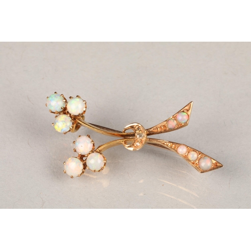 68 - 15 carat gold opal brooch of stylised floral form, length 36mm, weight 3g