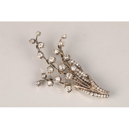 79 - Diamond floral brooch, unmarked metal set with graduated old cut diamonds, ranging from 0.33 carats ... 