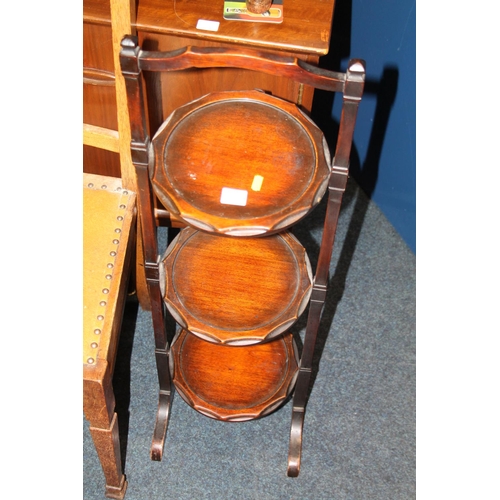 596 - Mahogany folding plate stand.