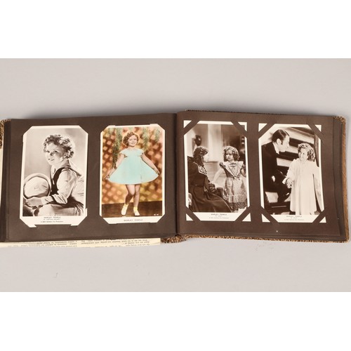 260 - Screen stars album of over 100 black and white postcards, featuring Shirley Temple 20th century fox ... 