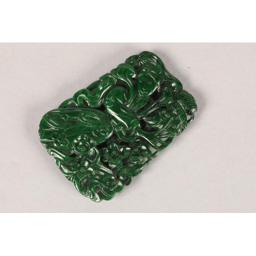 83 - Carved jade like; possibly Spinach jade pendant; decorated with figure; 5cm long