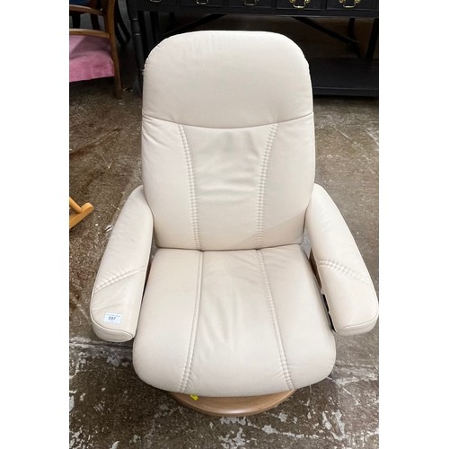 597 - Cream leather reclining rocking chair