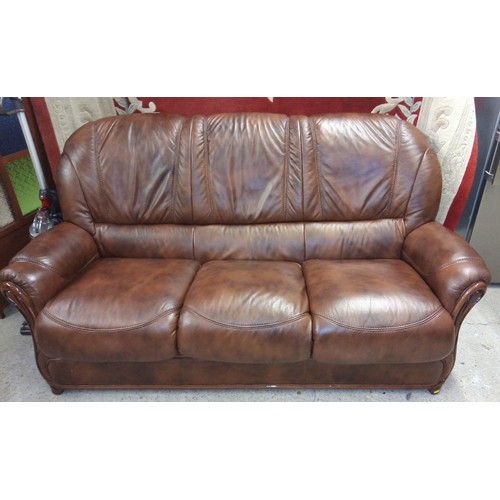 645 - Brown leather three seater settee