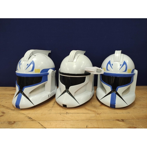 94 - Star Wars - Three 2008 Hasbro 'The Clone Wars' helmets comprising of Clone trooper and two Captain R... 