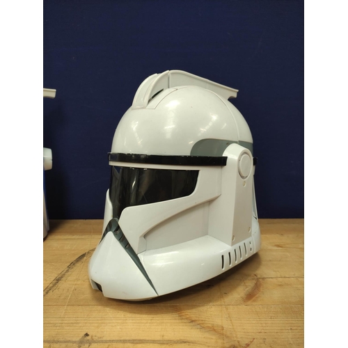 94 - Star Wars - Three 2008 Hasbro 'The Clone Wars' helmets comprising of Clone trooper and two Captain R... 