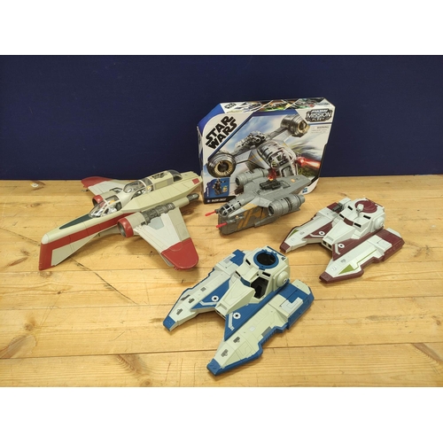 105 - Star Wars - Four model vehicles comprising of a Hasbro F0589 Mandalorian Razor Crest, Arc 170 Clone ... 