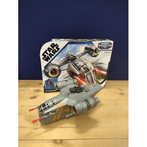 105 - Star Wars - Four model vehicles comprising of a Hasbro F0589 Mandalorian Razor Crest, Arc 170 Clone ... 