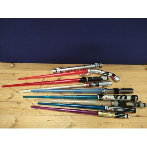 106 - Star Wars- Quantity of toy light sabers to include Obi Wan, Mace Windu, Count Dooku and Darth Maul. ... 