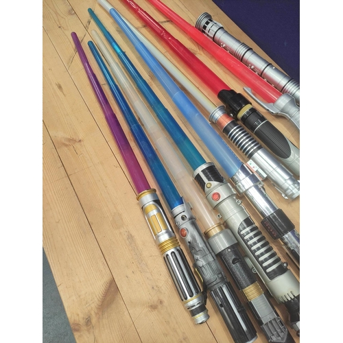 106 - Star Wars- Quantity of toy light sabers to include Obi Wan, Mace Windu, Count Dooku and Darth Maul. ... 