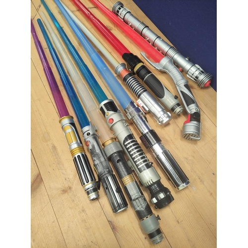 106 - Star Wars- Quantity of toy light sabers to include Obi Wan, Mace Windu, Count Dooku and Darth Maul. ... 