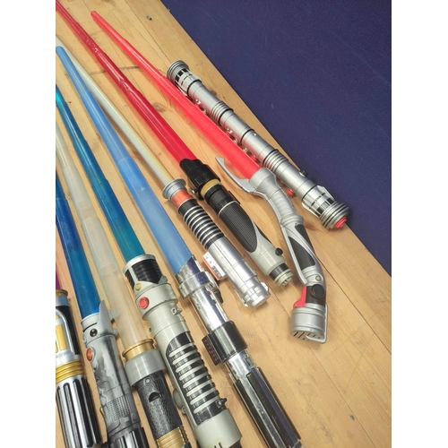 106 - Star Wars- Quantity of toy light sabers to include Obi Wan, Mace Windu, Count Dooku and Darth Maul. ... 