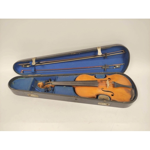 459 - Cased violin with inner inscribed Antonius Stradivarius Deutfine Urbeit 1886 and two bows.