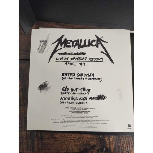 Metallic box-set comprising of 3 records, Live at Wembley Stadium