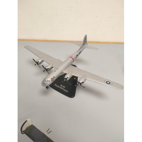 41 - Seven collector's model airplanes. To include a Supermarine Spitfire MKI, B-29 Superfortress, B-24 L... 