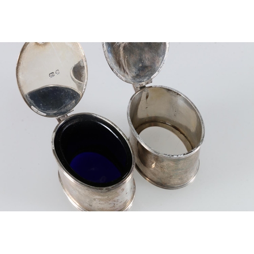 104 - Pair of sterling silver mustard pots, one with blue glass liner, Tessiers Ltd, London, 1963, 245g.