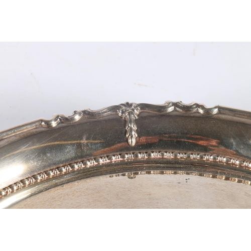 129 - Sterling silver salver, with shaped rim, raised on paw supports, Alexander Clark & Co. Ltd, Birm... 