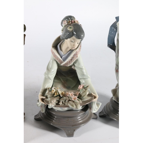 178 - Four Lladro Spanish porcelain figurines to include 4807 Geisha with fan, 5775 crouching Geisha with ... 