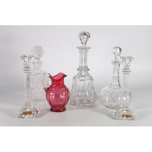 189 - Pair of Nachtmann of Germany crystal glass candlesticks, a cranberry glass jug and three cut glass d... 