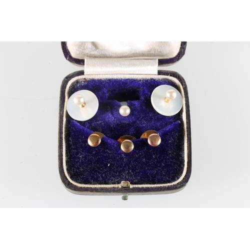 235 - Three 9ct gold buttons 2.5g and three mother of pearl buttons in A McKenzie of Turriff jewellery box... 