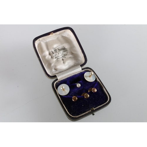 235 - Three 9ct gold buttons 2.5g and three mother of pearl buttons in A McKenzie of Turriff jewellery box... 