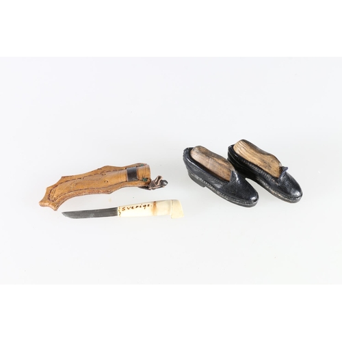 247 - A pair of miniature leather shoes, possibly for a doll with carved wood 'shoe tree' blocks, 6cm long... 