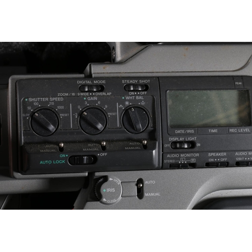 272 - Sony DCR-VX9000E digital video camera recorder with fixed 3CCD 20x digital zoom lens.