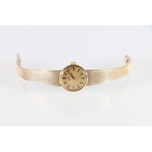 64 - Ladies 9ct gold Omega wristwatch with 9ct gold strap, 20.7g.