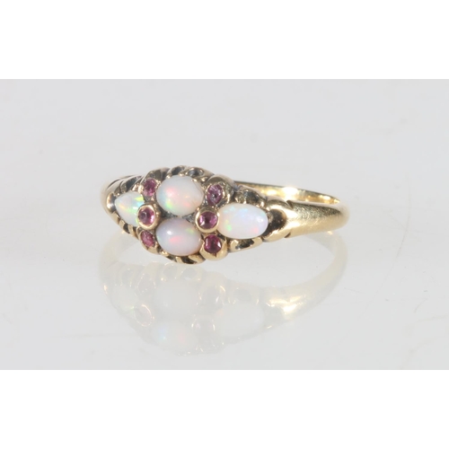 69 - Victorian gold opal and ruby set res ring, size N, 2.2g.