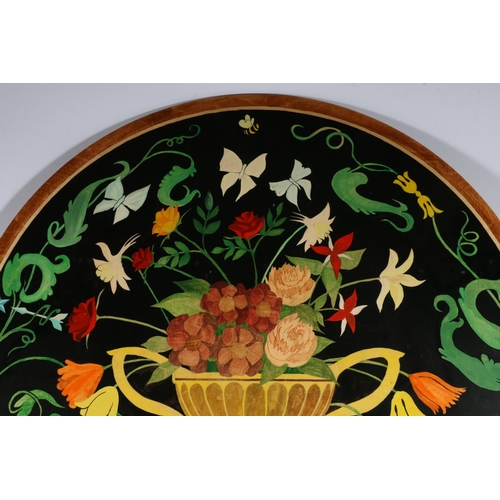 302 - Painted plywood circular panel depicting a urn of flowers within a wreath with butterflies and insec... 