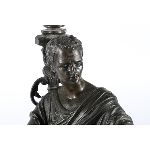 311 - Cast metal figure of a Roman or Greek classical figure positioned sat reading a scroll, upon ebonise... 